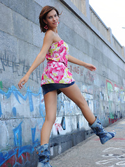 Suzanna A sensually poses outdoors as she strips her beautiful dress.